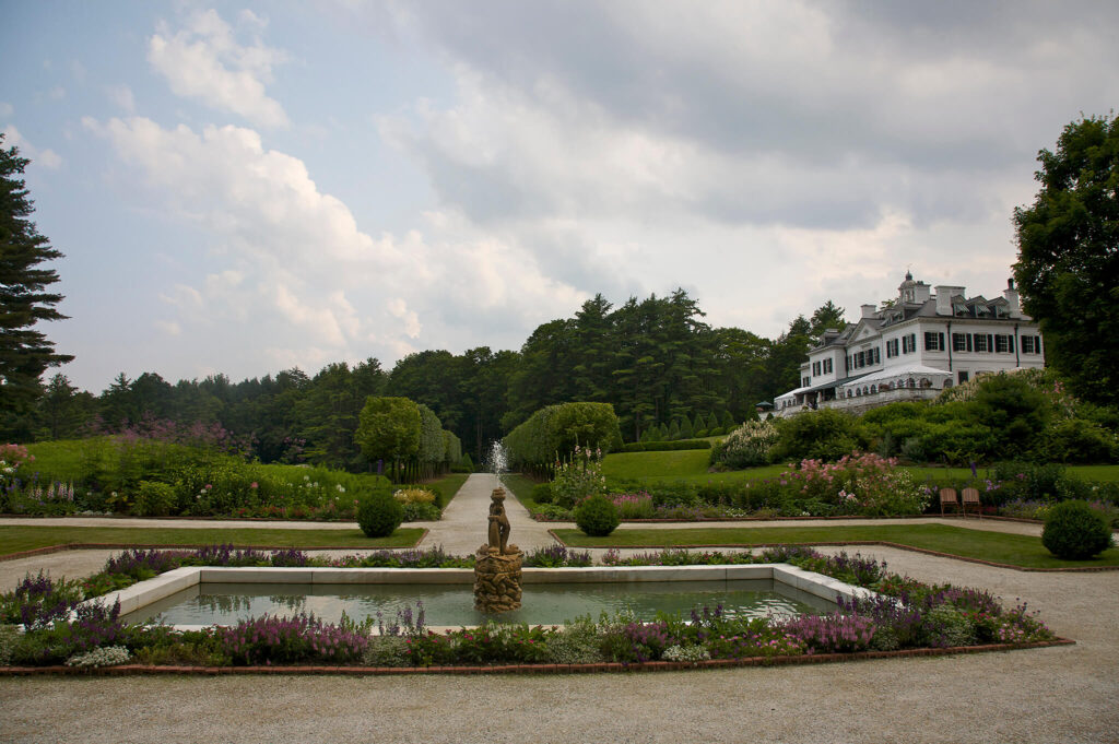 Well-manicured gardens and elegant fountains surround The Mount.