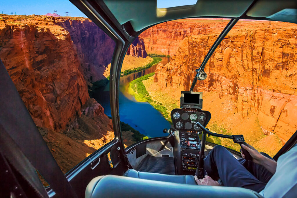 Dramatic Grand Canyon views from the clear windows of a helicopter.